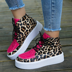 Patent leopard platform high-tops with hot pink accents and black laces.