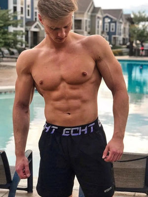 Black performance training shorts with branded waistband