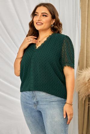 Dark green textured dot blouse with lace trim V-neck and short sleeves.