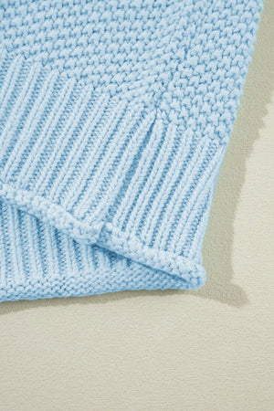 Light blue knit turtleneck shell with ribbed texture detail