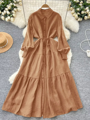 Caramel textured tiered long sleeve button-down midi dress with tie waist