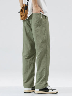 Relaxed fit wide-leg sweatpants in sage green with a textured finish and pockets.