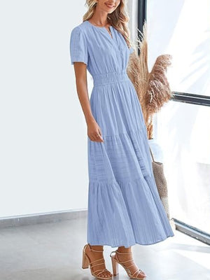 Light blue V-neck tiered maxi dress with smocked waist and short sleeves.
