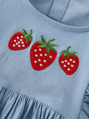 Light blue denim baby dress with embroidered strawberries and ruffled hem.