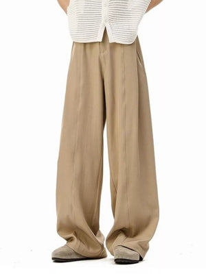 Men's khaki wide-leg track pants with front seams and pockets.