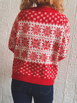 Red and white acrylic knit pullover sweater with snowflake pattern.