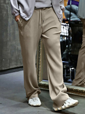 Khaki textured wide-leg drawstring lounge trousers with vertical ribbing.