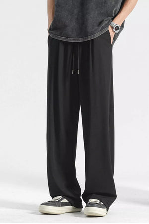 Black sweatpants with drawstring waist and wide leg