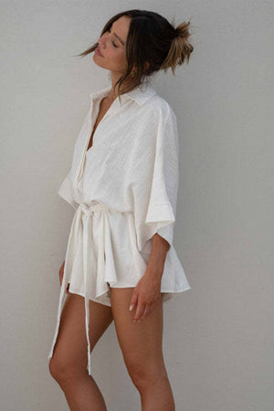 White linen kimono sleeve romper with tie waist and collar