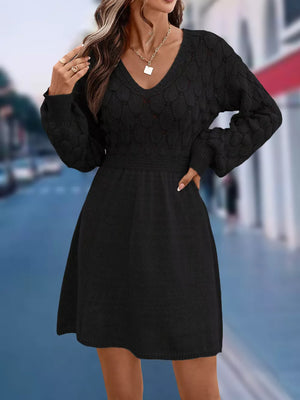 Black openwork knit V-neck sweater dress with cinched waist and above knee length.