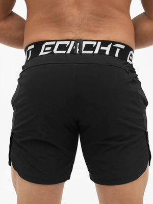 Black performance training shorts with branded waistband