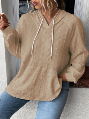 Camel textured knit raglan hoodie with white drawstrings and front pocket.