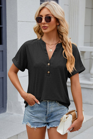 Textured black henley tee with rolled sleeves and button detail