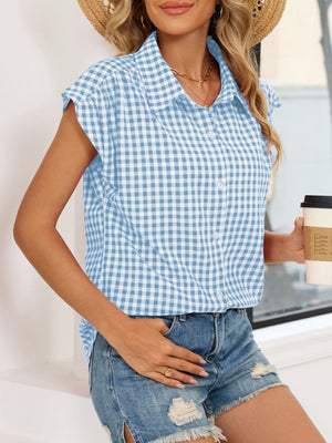 Sky blue gingham cotton shirt with cap sleeves and button-down front.