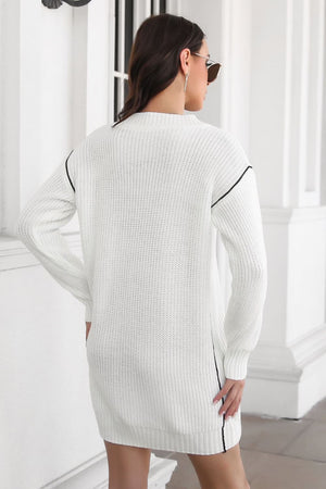 White acrylic sweater dress with V-neck and black stitch detail accents