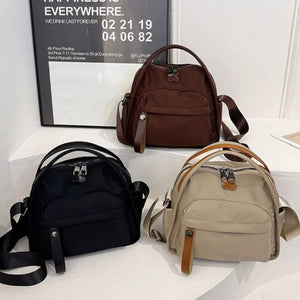 Nylon chest bag in black, brown, and khaki with adjustable strap and multiple pockets.