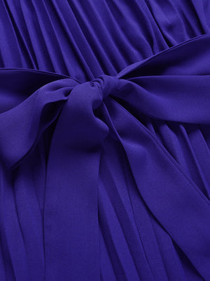 Dark blue halter neckline pleated palazzo jumpsuit with a tie waist detail.