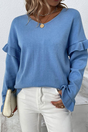 Blue knit pullover sweater with V-neck and ruffled sleeves.