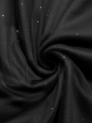 Black glitter tulle fabric detail, showing sheer mesh with scattered sparkle accents.