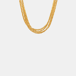 Delicate multi-strand gold-plated chain necklace with a cascading design.