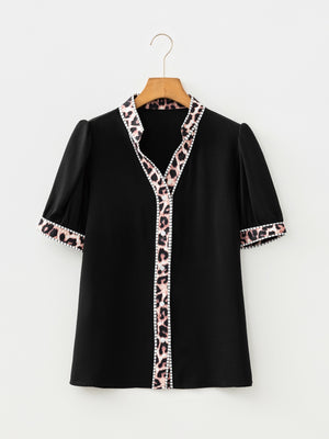 Black puff sleeve blouse with leopard trim and button front
