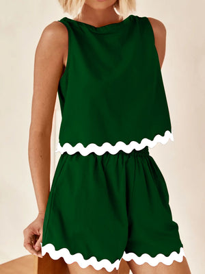 Dark green scalloped edge tank and shorts set with white trim.
