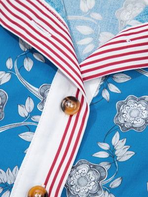 Blue cotton blouse with botanical print, white placket, and red striped collar.