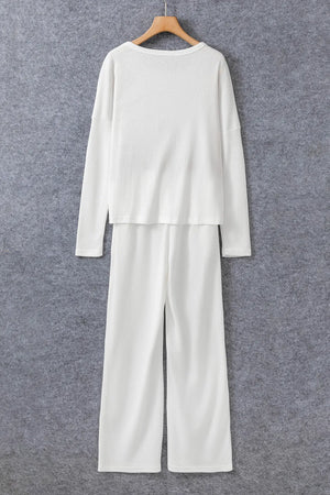 White ribbed loungewear set with crew neck long sleeve top and wide leg pants