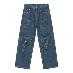 Medium wash denim cargo pants with buckle flap pockets and utility straps.