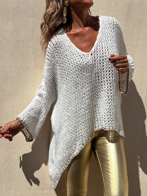 White open knit sweater with asymmetric hem and beaded trim, V-neck, long sleeves.