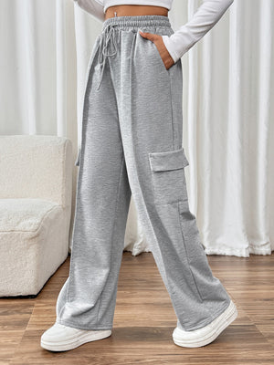Gray cargo pocket wide leg sweatpants with drawstring waist and side pockets.