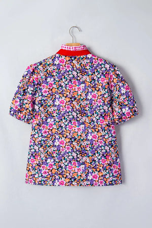 Floral print polyester shirt with red collar and plaid trim, puff sleeves.