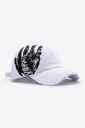 White baseball cap with black graffiti hand print and distressed brim.