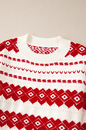 White crewneck pullover sweater with red Fair Isle pattern and ribbed neckline.
