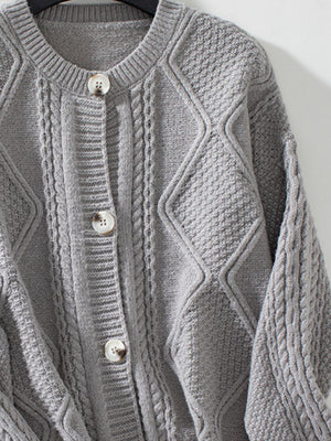 Gray cable-knit button-down cardigan with diamond and cable textures.