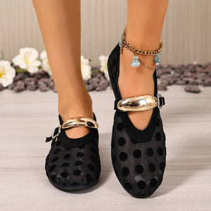Black polka dot mesh slip-on flats with gold buckle detail and anklet.