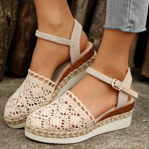 Ivory crochet espadrille wedge sandals with adjustable ankle strap and round toe.
