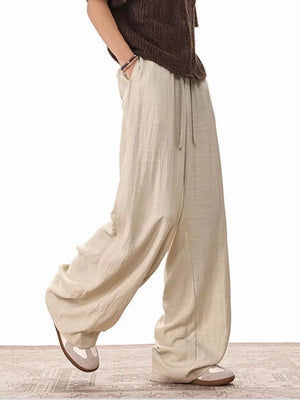 Relaxed fit khaki drawstring sweatpants with pockets and wide legs.