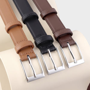 Timeless leather skinny belts in black, brown, and coffee brown with silver buckles.
