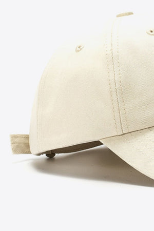 Beige cotton baseball cap with adjustable strap detail