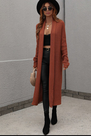 Textured knit maxi cardigan in brown with open front and long sleeves.