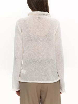 White sheer mock neck knit sweater with long sleeves and a draped fit.