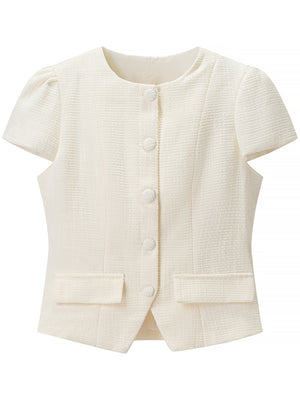 Textured cream button-down top with short puff sleeves and pocket details.