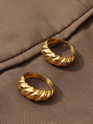Gold sculpted steel croissant ring with twisted band detail