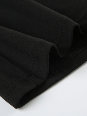 Black long-sleeve active romper with visible stitching detail