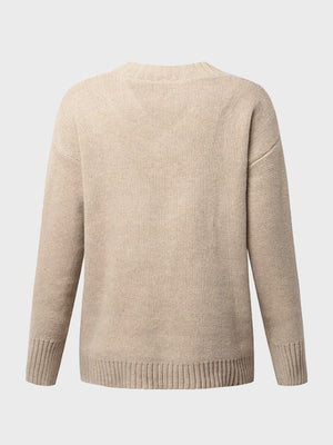 Tan ribbed trim V-neck knit sweater with long sleeves and crew neckline.