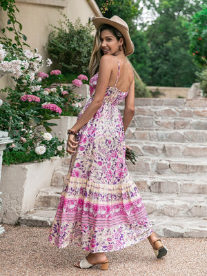Pink floral print viscose maxi dress with spaghetti straps and tiered skirt.
