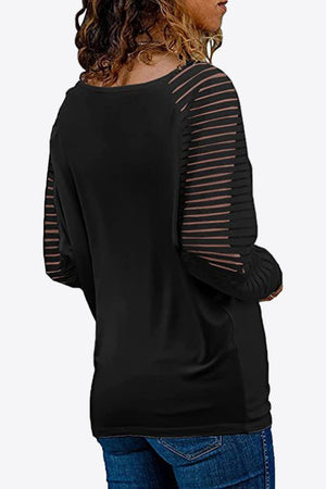Black long sleeve raglan top with sheer striped sleeves and a V-neck.