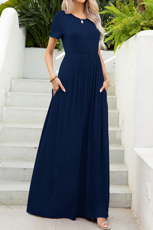 Navy gathered waist maxi dress with pockets and short sleeves.