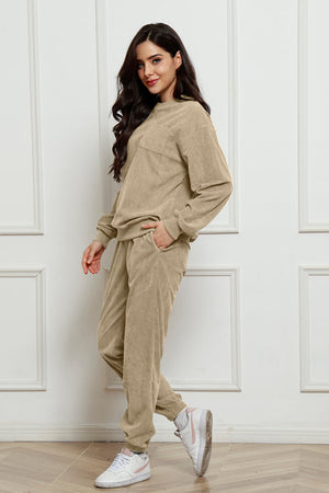 Beige corduroy lounge set with crew neck sweatshirt and jogger pants, featuring a chest pocket.